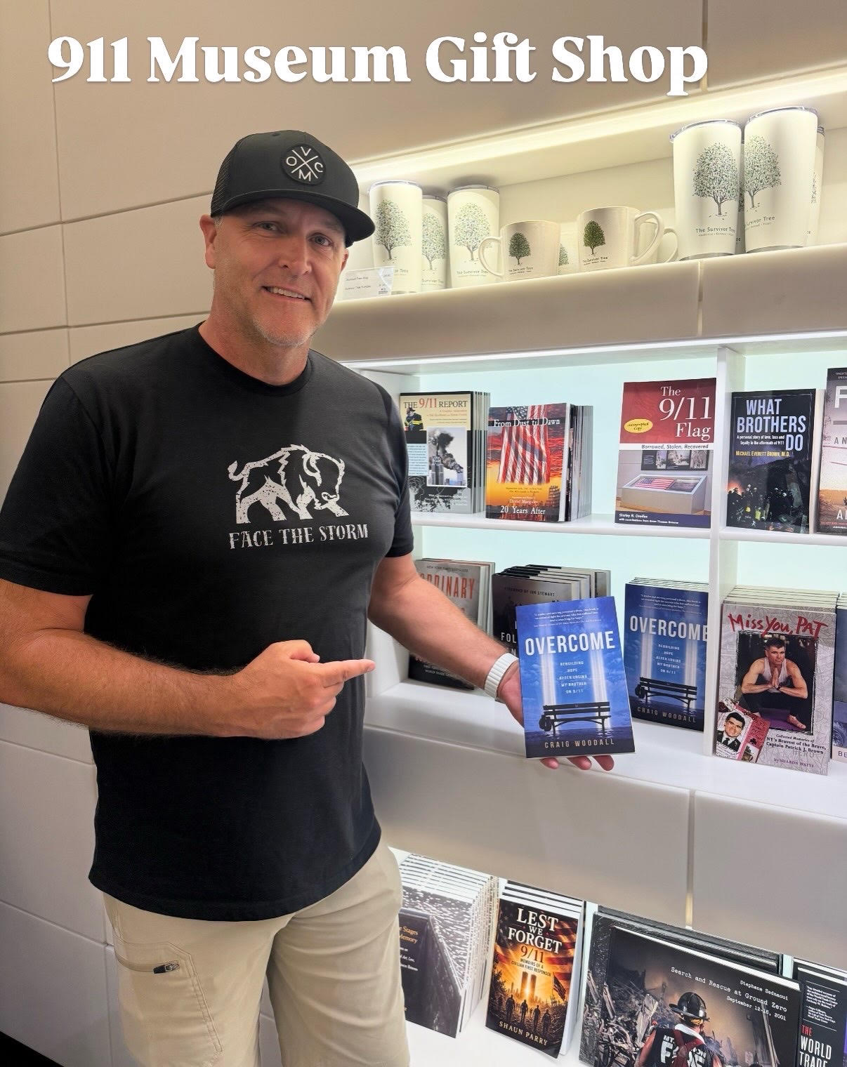 Craig Woodall holding his book Overcome in the 9/11 Memorial and Museum gift shop